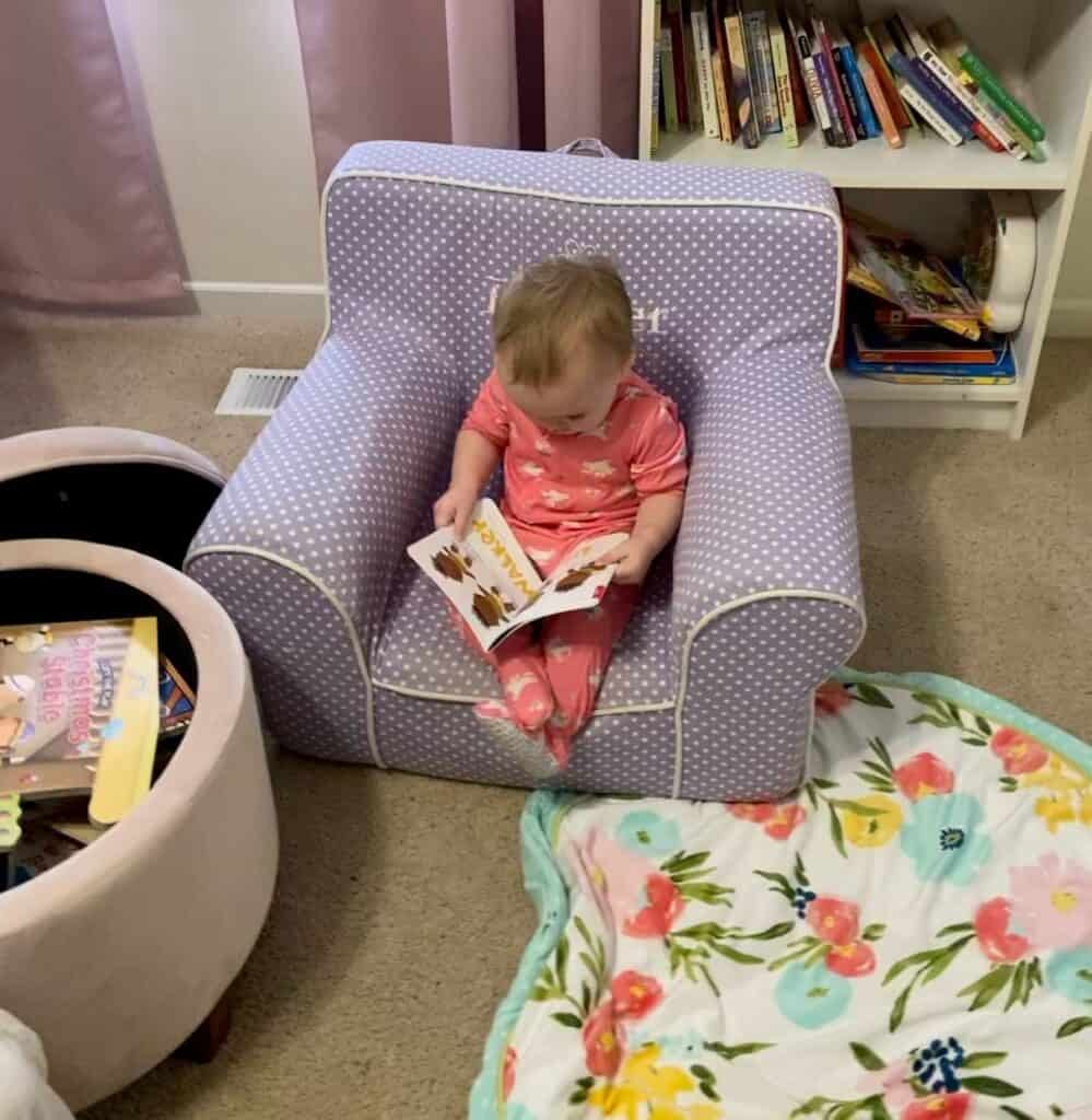 baby in chair with books