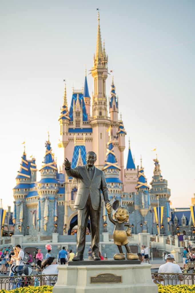 Cinderella castle and Walt Disney statue