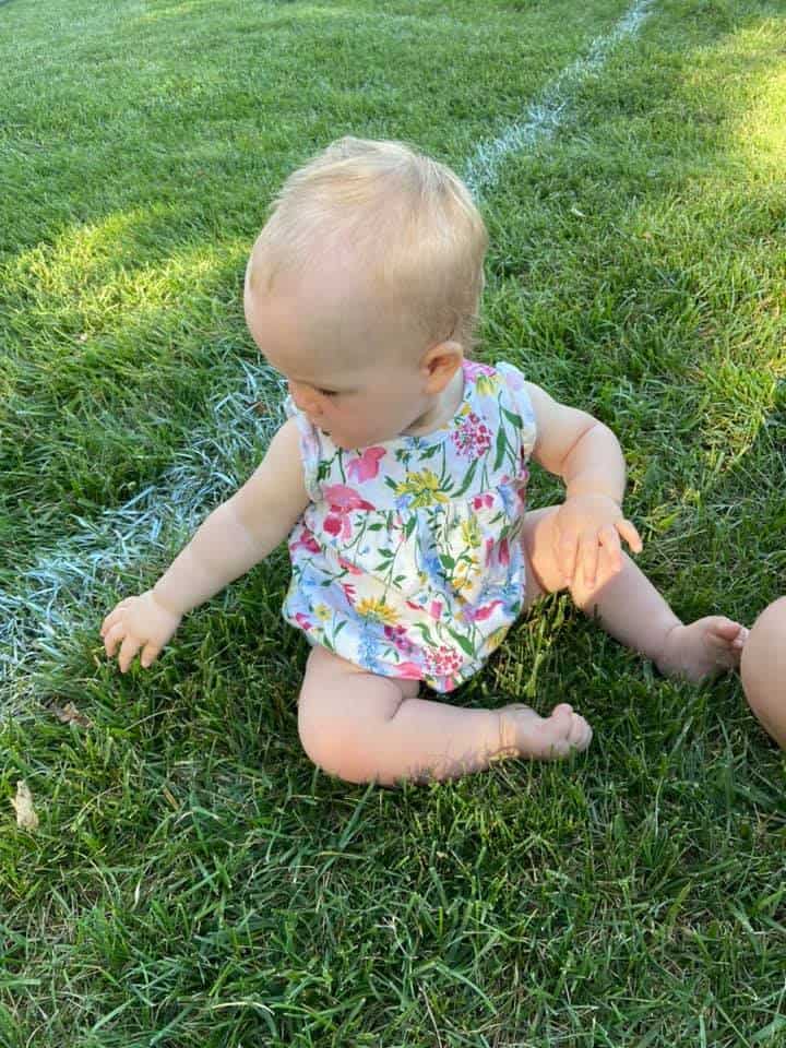 baby on green grass