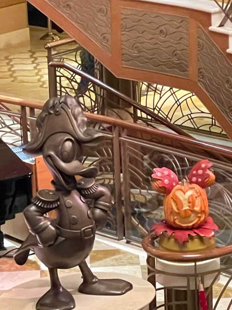 Donald Duck statue with pumpkin